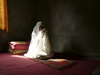 Woman at prayer.