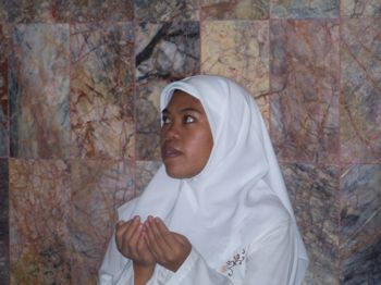 Woman at prayer.